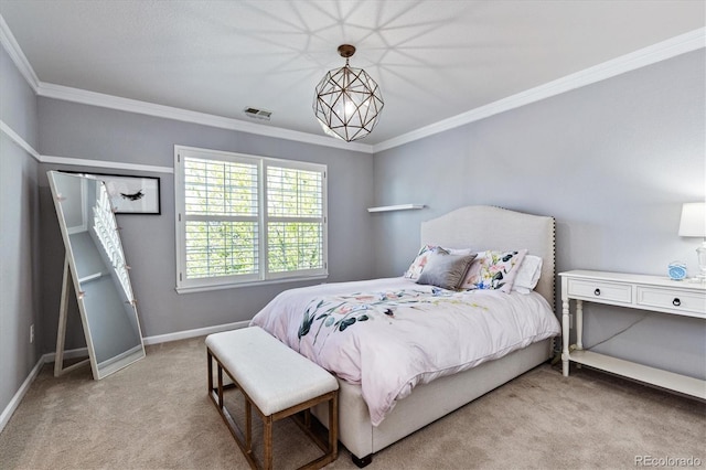 bedroom featuring crown molding, baseboards, and carpet flooring