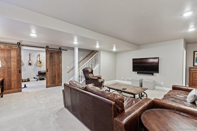living area with baseboards, light carpet, recessed lighting, stairs, and a barn door