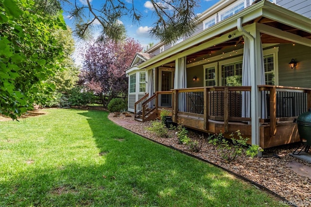 view of side of property with a porch and a lawn