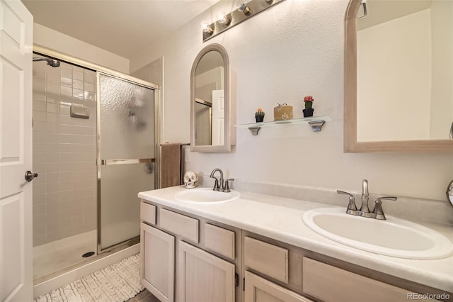 bathroom with vanity and an enclosed shower