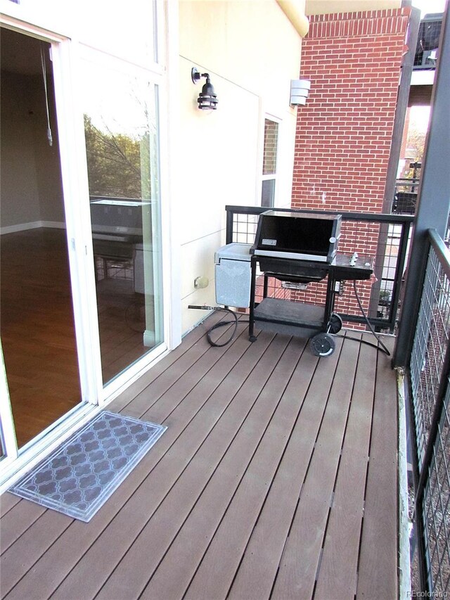 wooden deck with grilling area