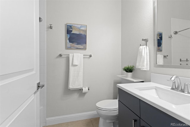 bathroom with vanity, walk in shower, baseboards, toilet, and tile patterned flooring