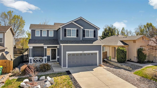 1899 Woodpark Dr, Colorado Springs, CO 80951 - traditional-style house with fence, driveway, a garage, and roof with shingles