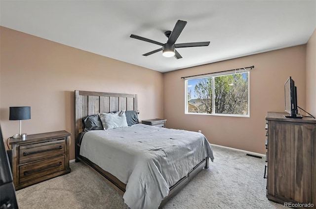 1899 Woodpark Dr, Colorado Springs, CO 80951 - bedroom with light colored carpet, baseboards, and a ceiling fan