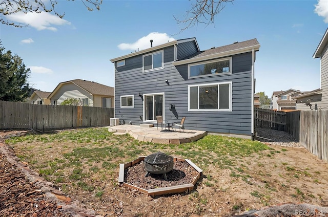 1899 Woodpark Dr, Colorado Springs, CO 80951 - rear view of property with an outdoor fire pit, a fenced backyard, and a patio area