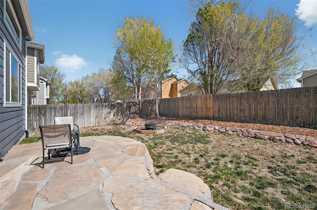 1899 Woodpark Dr, Colorado Springs, CO 80951 - fenced backyard featuring a patio area and an outdoor fire pit
