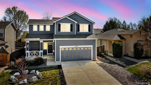 1899 Woodpark Dr, Colorado Springs, CO 80951 - traditional-style home with fence, driveway, a garage, roof with shingles, and a porch