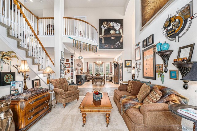 living room with a high ceiling and a notable chandelier