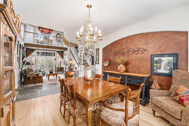 dining room featuring wood-type flooring and a chandelier