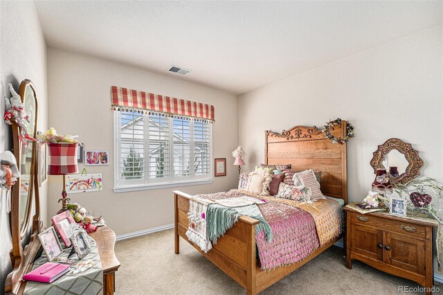 bedroom featuring light colored carpet