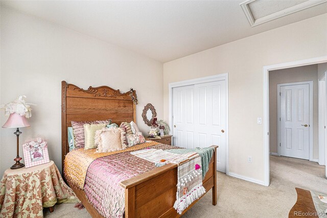 carpeted bedroom featuring a closet