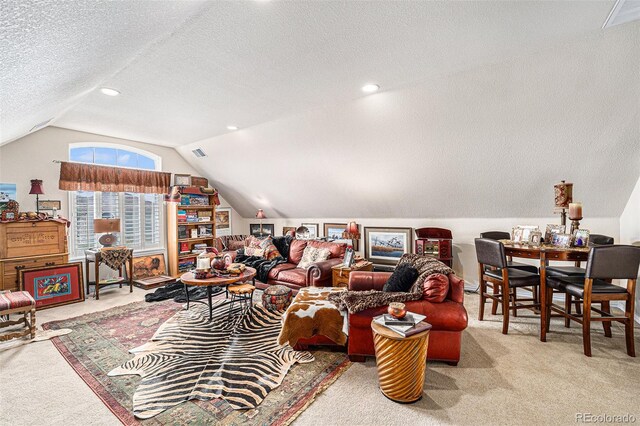 carpeted living room with lofted ceiling and a textured ceiling