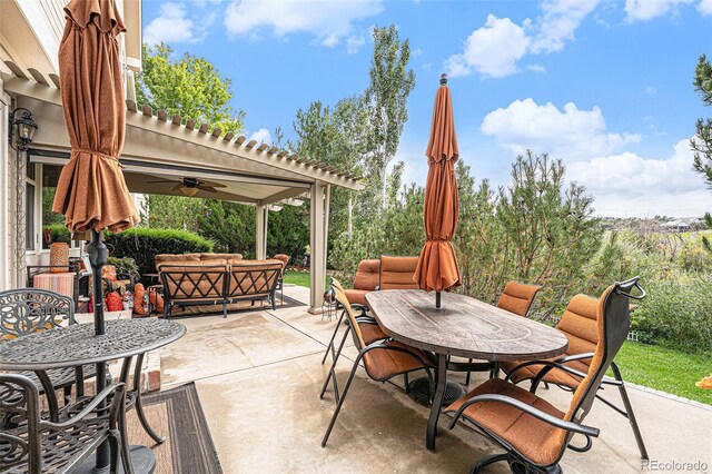 view of patio featuring ceiling fan