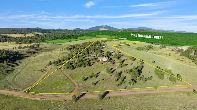 aerial view featuring a rural view and a mountain view