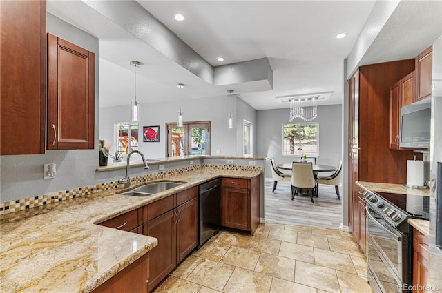 kitchen featuring light wood-type flooring, electric range oven, light stone counters, dishwasher, and sink