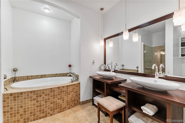 bathroom with separate shower and tub, tile patterned floors, and vanity