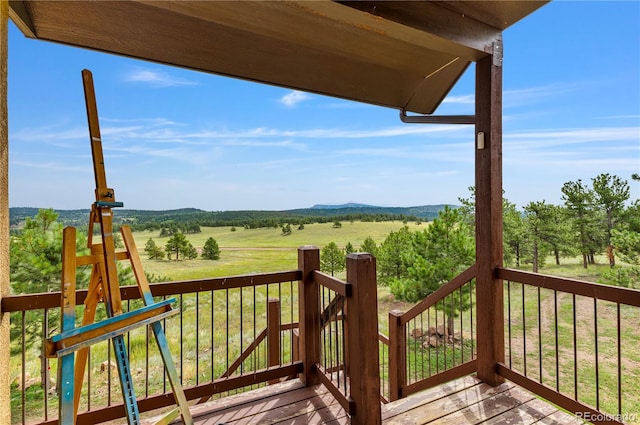 wooden deck featuring a rural view