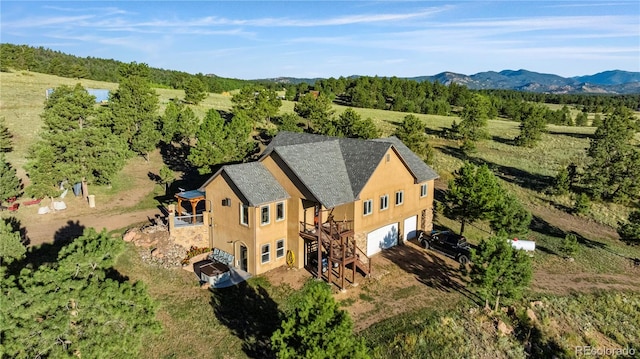 drone / aerial view featuring a mountain view