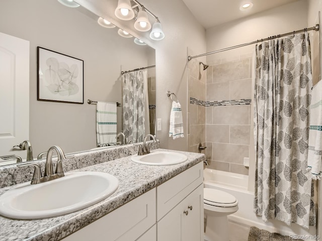 full bathroom with toilet, vanity, and shower / bathtub combination with curtain