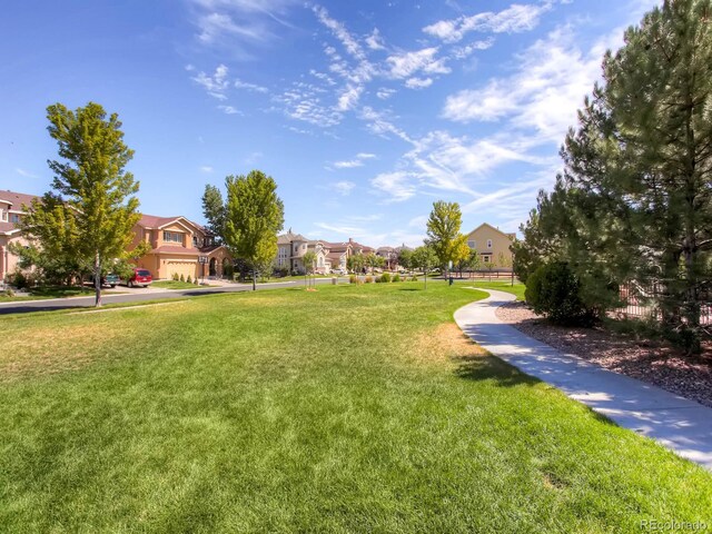 view of home's community featuring a yard