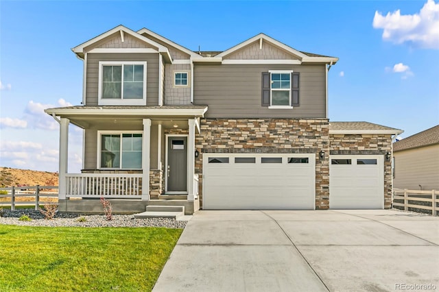 craftsman inspired home with a front lawn and covered porch