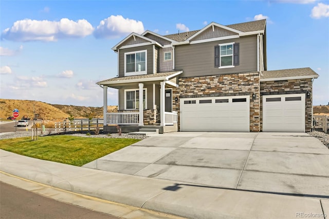 craftsman inspired home with a porch, a mountain view, and a front yard