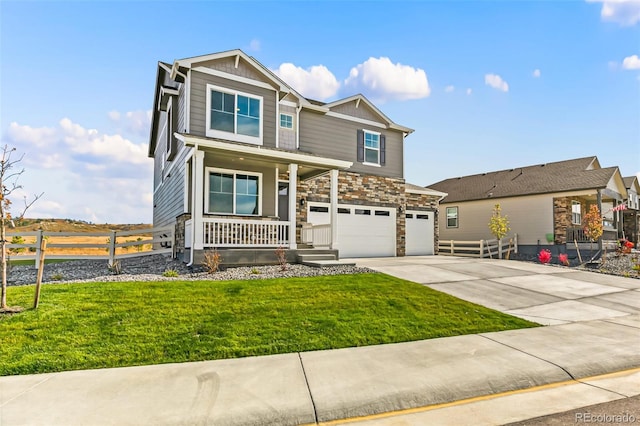 view of front of home with a garage, covered porch, and a front lawn