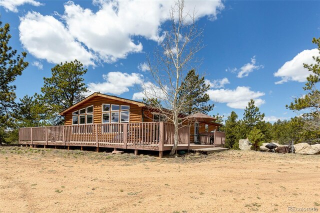 1258 Aspen Trl, Hartsel, CO 80449 - back of property with faux log siding and a deck