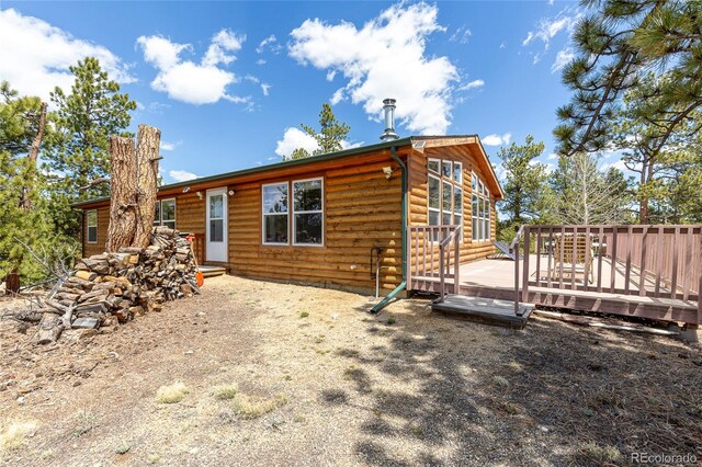 1258 Aspen Trl, Hartsel, CO 80449 - back of house featuring log veneer siding and a wooden deck