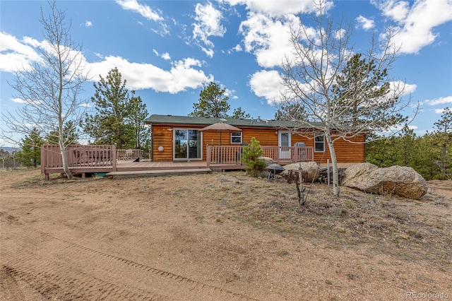 1258 Aspen Trl, Hartsel, CO 80449 - view of front facade featuring faux log siding and a deck