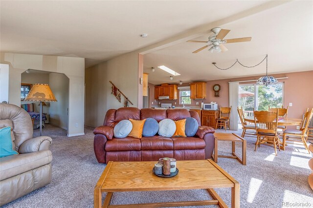 1258 Aspen Trl, Hartsel, CO 80449 - living room with light colored carpet, a ceiling fan, and vaulted ceiling