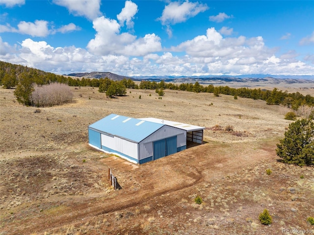 birds eye view of property with a mountain view