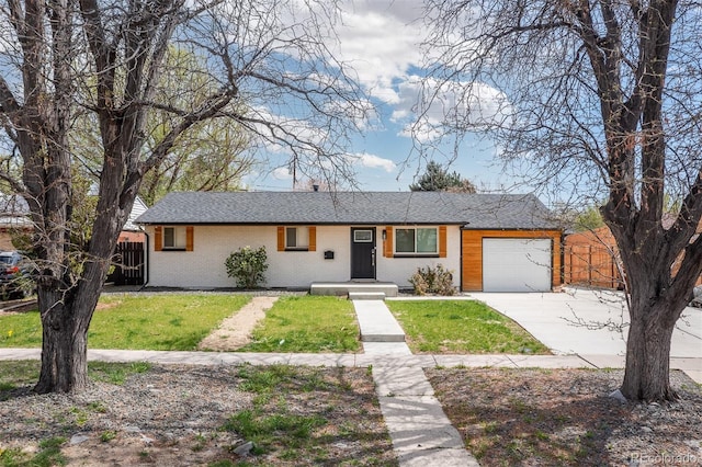 ranch-style home with fence, a front lawn, an attached garage, driveway, and roof with shingles