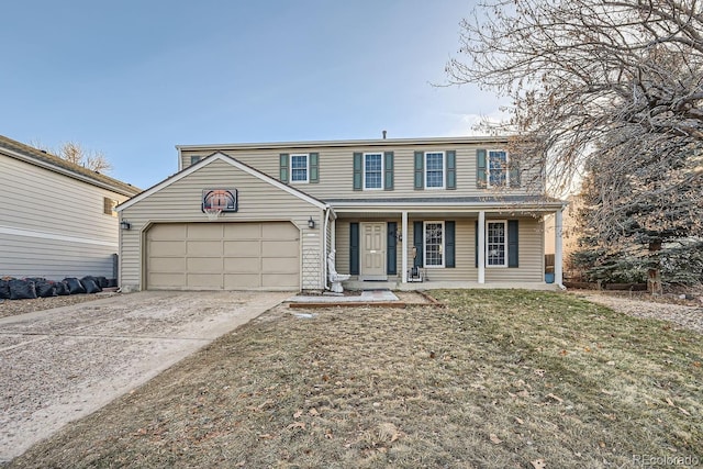 view of front of house featuring a front yard, a porch, and a garage