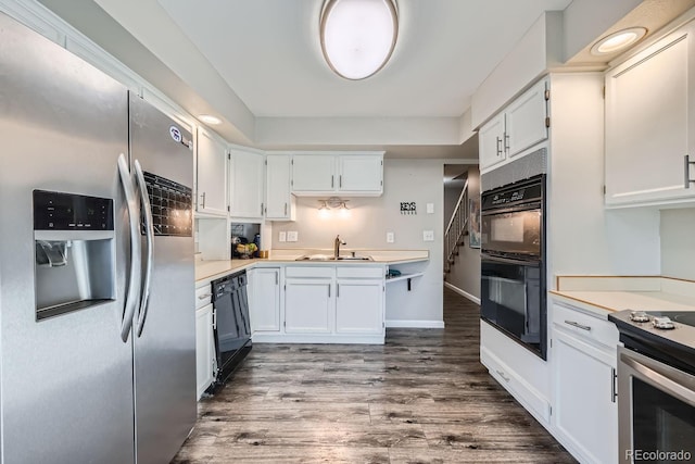 kitchen with sink, black appliances, white cabinetry, and dark hardwood / wood-style floors