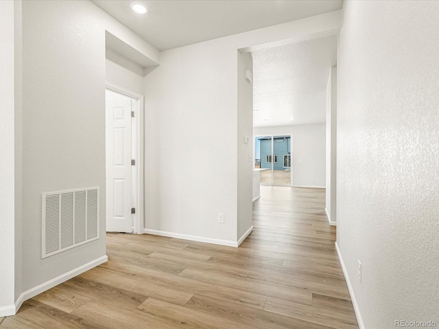 hallway featuring light hardwood / wood-style floors