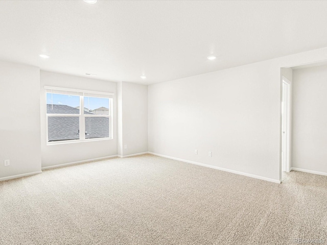 empty room featuring light carpet