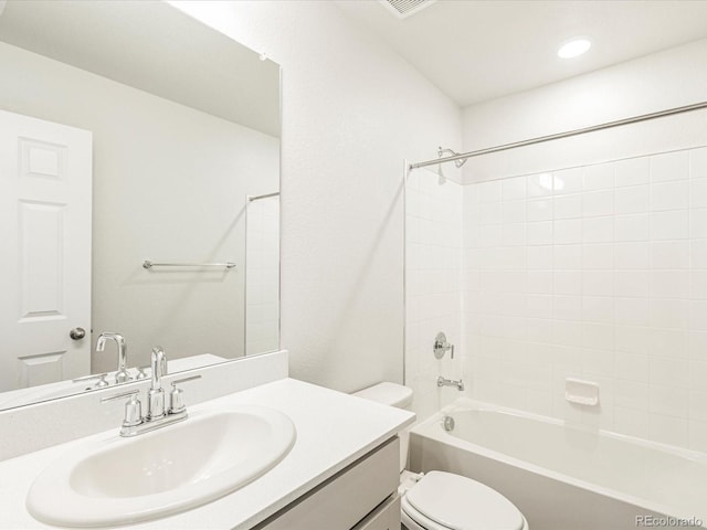 full bathroom featuring shower / bath combination, toilet, and vanity