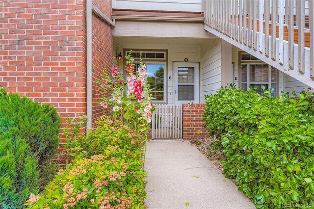 3040 W Prentice Ave Unit B, Littleton, CO 80123 - doorway to property featuring brick siding