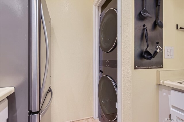 3040 W Prentice Ave Unit B, Littleton, CO 80123 - laundry area with stacked washer / dryer
