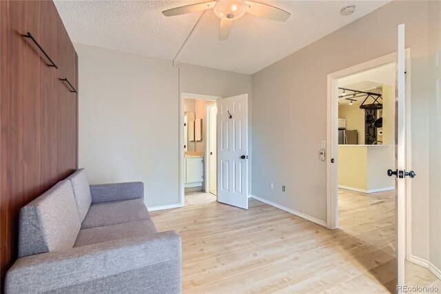 3040 W Prentice Ave Unit B, Littleton, CO 80123 - unfurnished room featuring a ceiling fan, light wood-style floors, and a textured ceiling