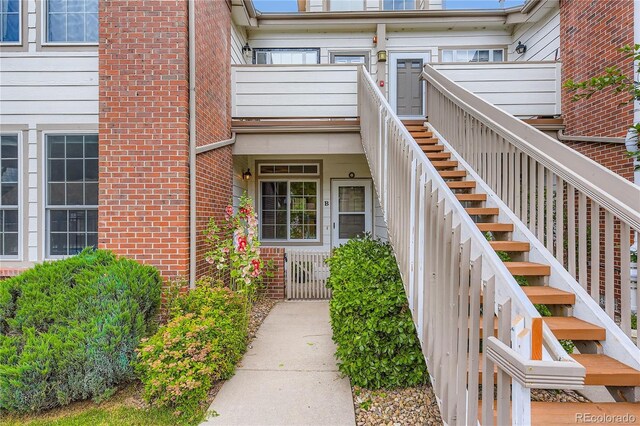 3040 W Prentice Ave Unit B, Littleton, CO 80123 - view of exterior entry featuring brick siding