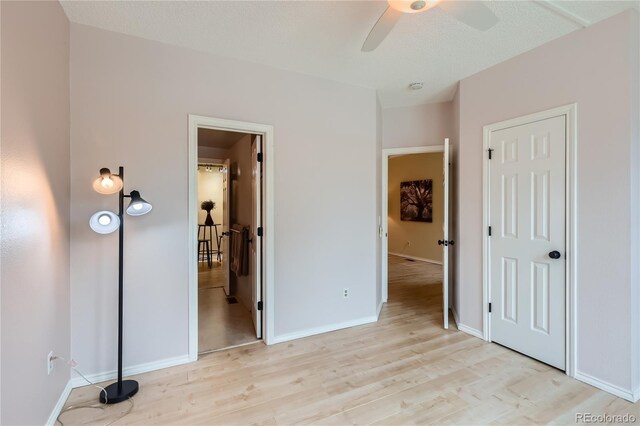 3040 W Prentice Ave Unit B, Littleton, CO 80123 - unfurnished bedroom featuring light wood-style flooring and baseboards
