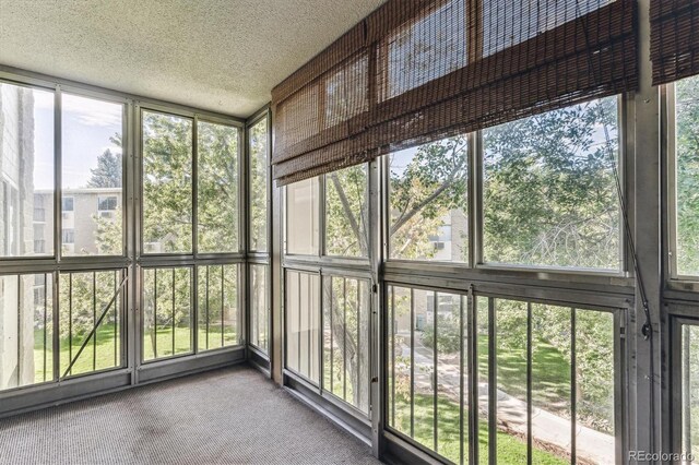 13500 E Cornell Ave Unit 302, Aurora, CO 80014 - unfurnished sunroom featuring plenty of natural light