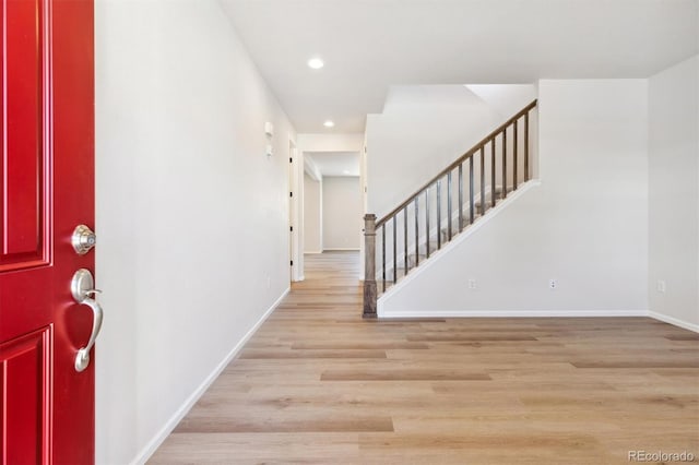 foyer with light hardwood / wood-style floors