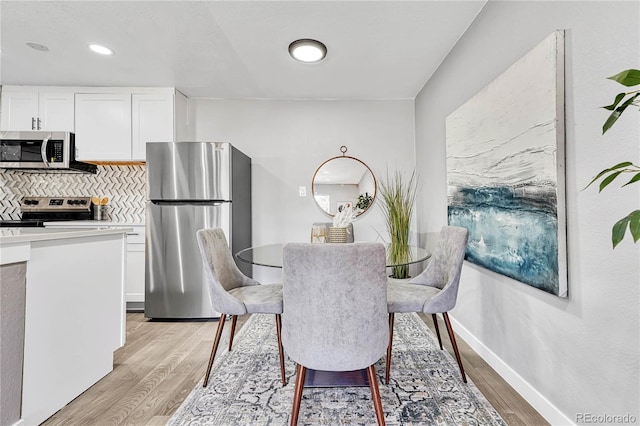 dining room with light hardwood / wood-style floors