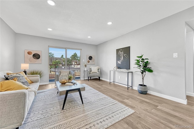 living room with light hardwood / wood-style flooring