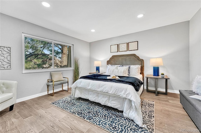 bedroom with light hardwood / wood-style floors