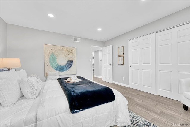 bedroom featuring a closet and hardwood / wood-style floors