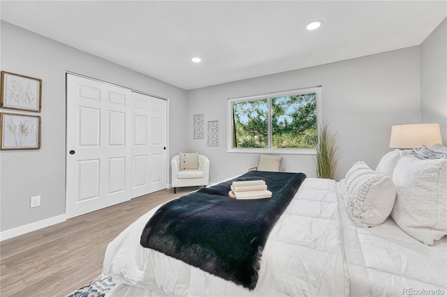 bedroom featuring hardwood / wood-style flooring and a closet